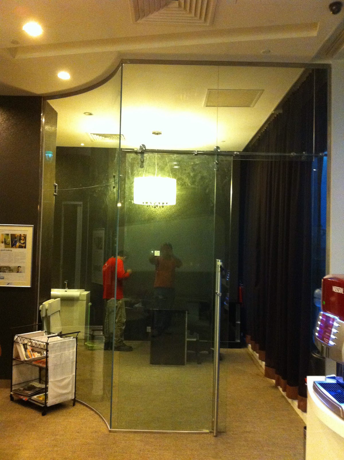 Frameless glass partitions being installed by the Vision 2 Engineering team during a fit-out